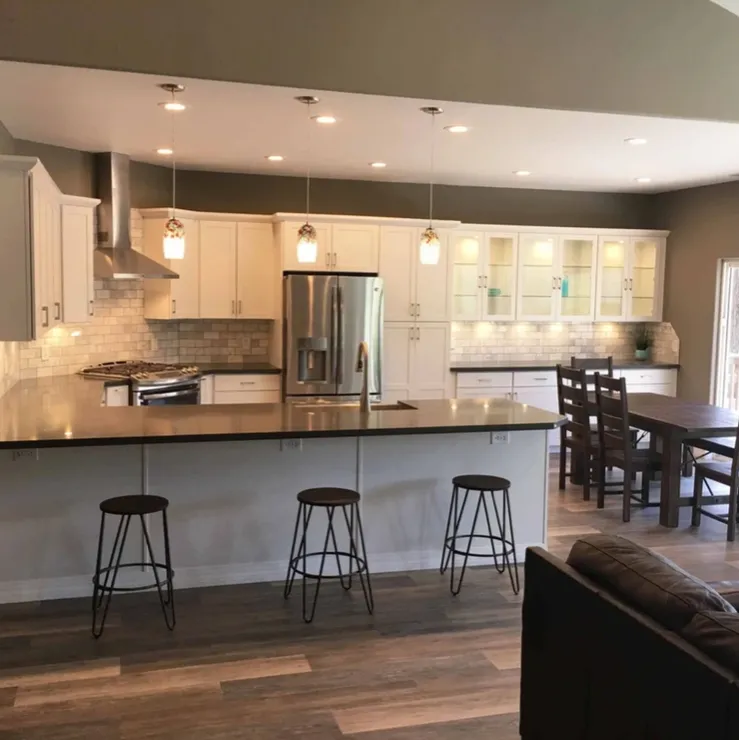 Modern kitchen remodel with white cabinets and island